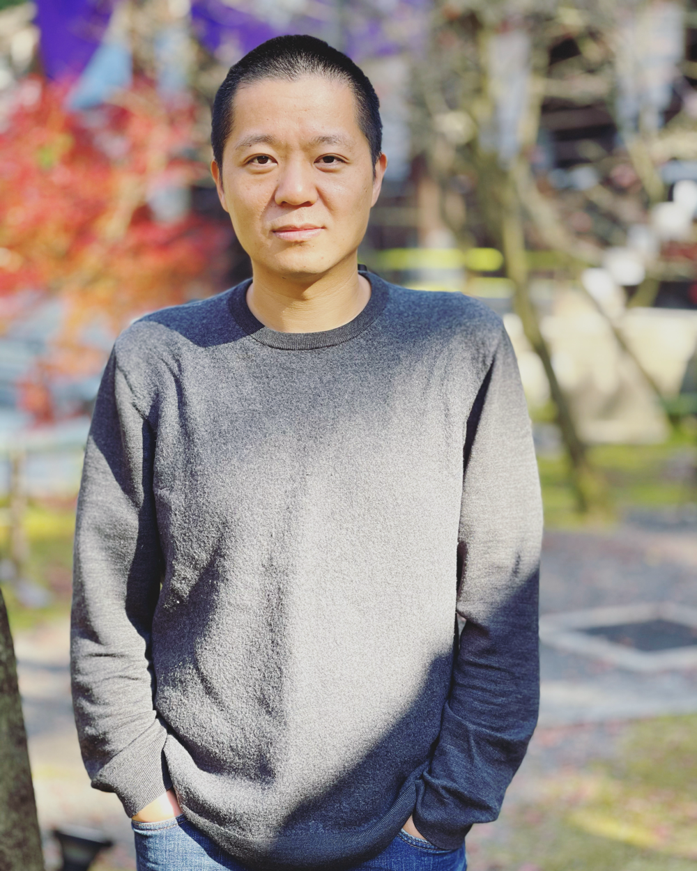 A person standing outside with his hands in his pockets
AI-generated content may be incorrect.
